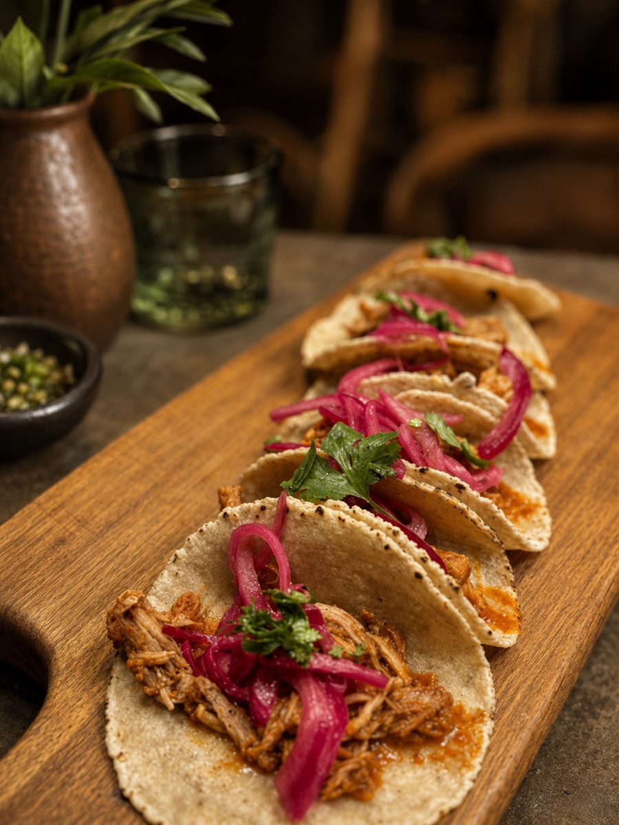 Cochinita pibil tacos with pickled onion